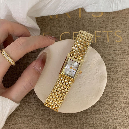 Goldiluxx Golden Quartz Rectangular Watch With A Steel Band For Women.