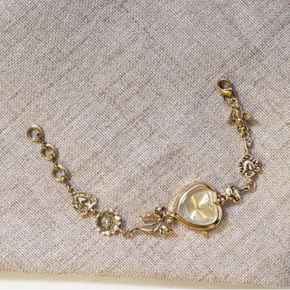 Goldiluxx Retro Heart-shaped Bracelet Watch With A Golden Bow And Flower Design A Stylish Womens Timepiece
